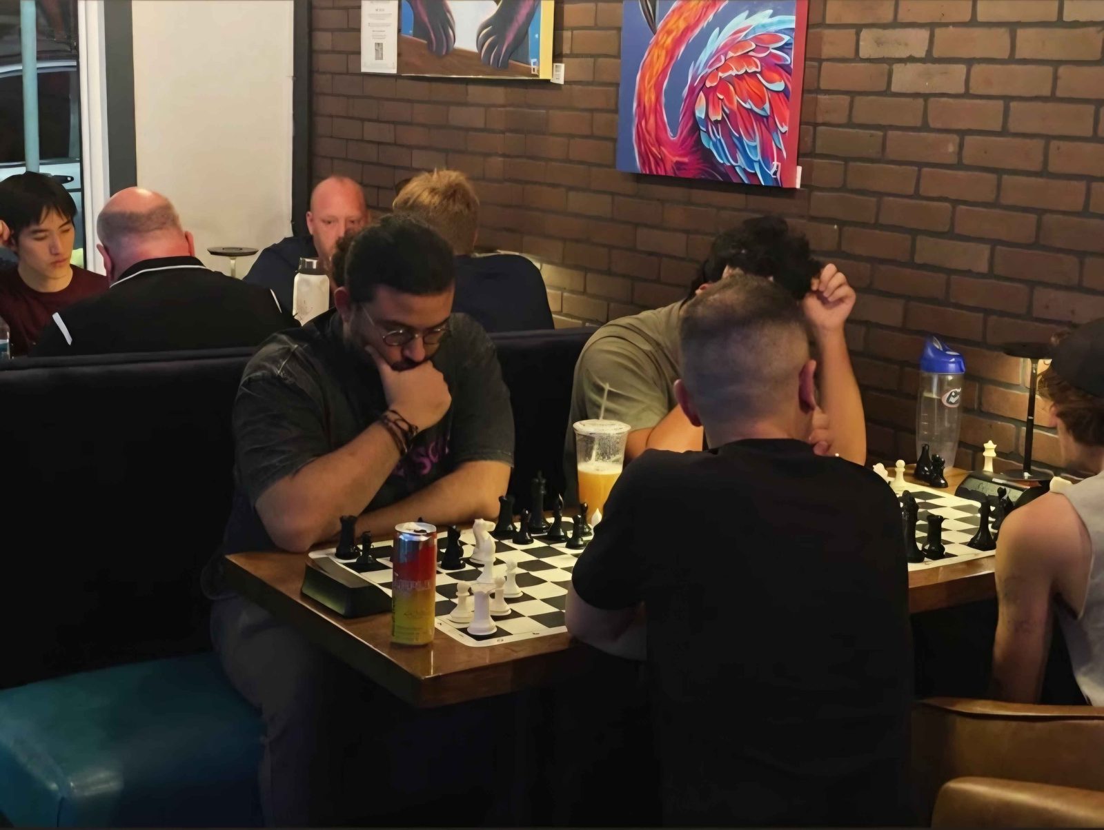 The playing room at Tampa Knights with games on every table